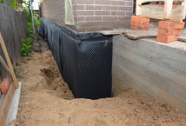 Happy homeowners after waterproofing job in Clear Brook